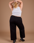 Back view of Organic Action Pants in Basic Black and vintage tee white Cropped Tank on Juliet