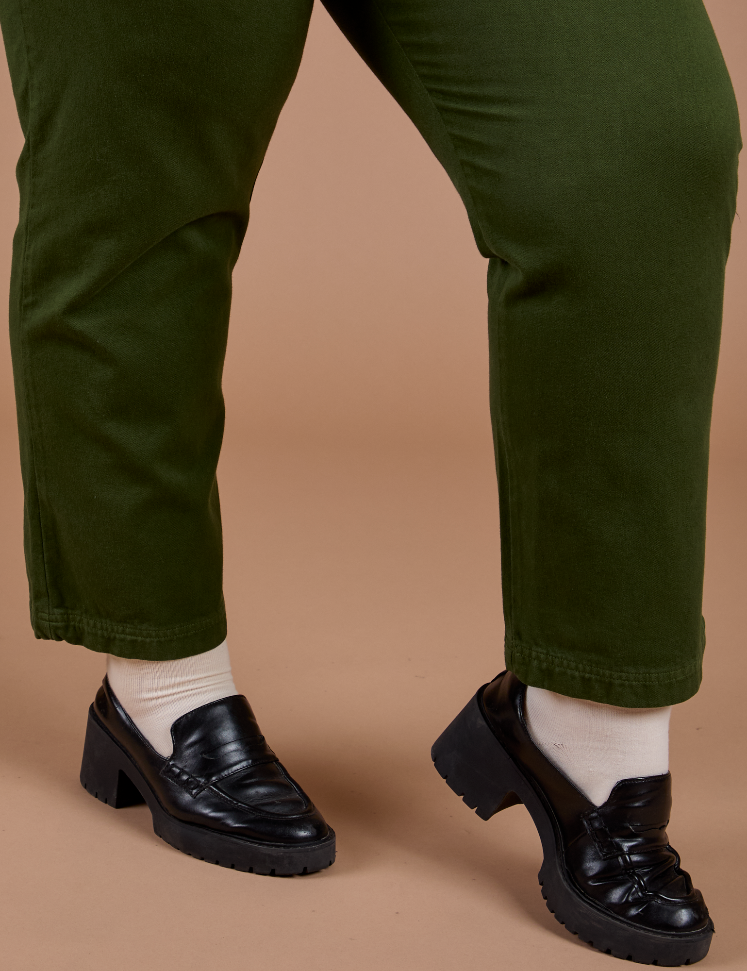 Organic Work Pants in Evergreen pant leg close up on Juliet