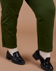 Organic Work Pants in Evergreen pant leg close up on Juliet