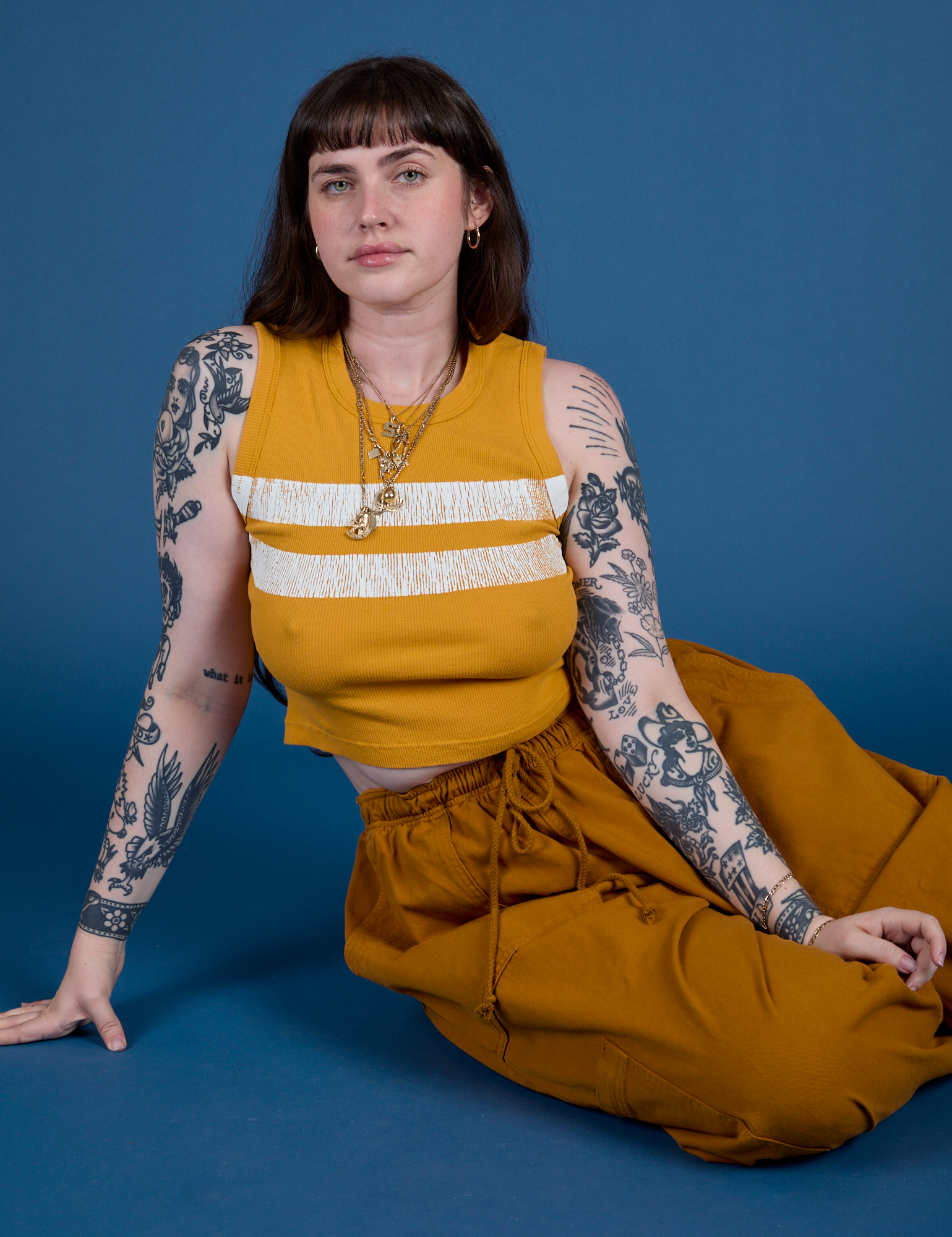 Painted Muscle Tee in Mustard Yellow and Drop Pocket Cargo Pants on Sydney