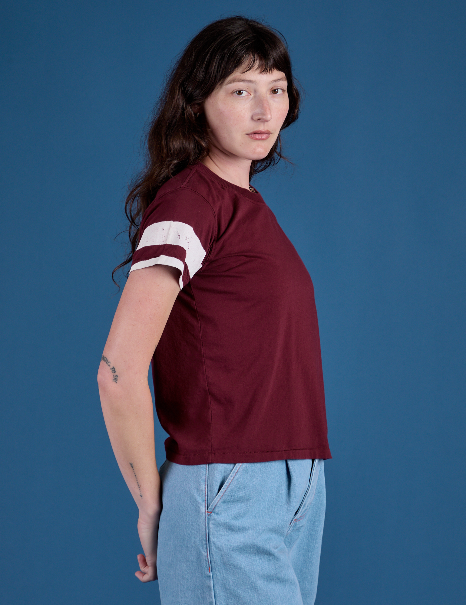 Painted Vintage Tee in Red Wine side view on Alex