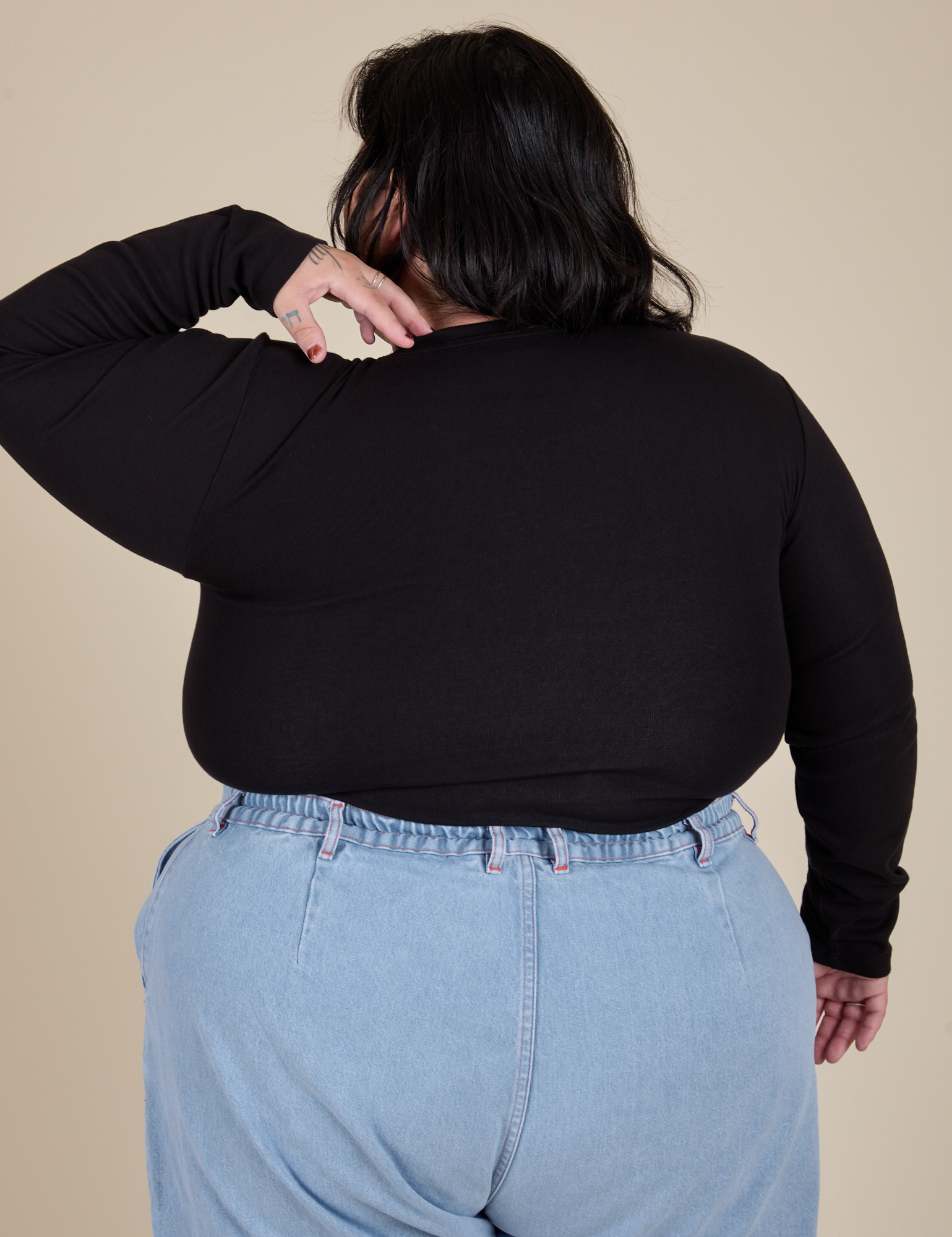 Long Sleeve Baby Tee in Basic Black back view on Sam