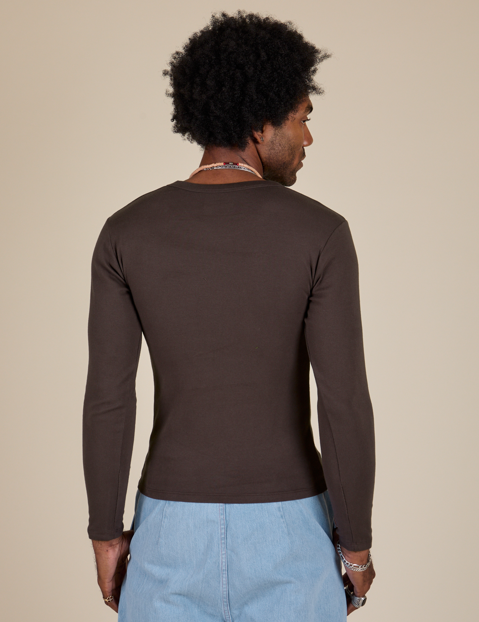 Long Sleeve Baby Tee in Espresso Brown back view on Jerrod