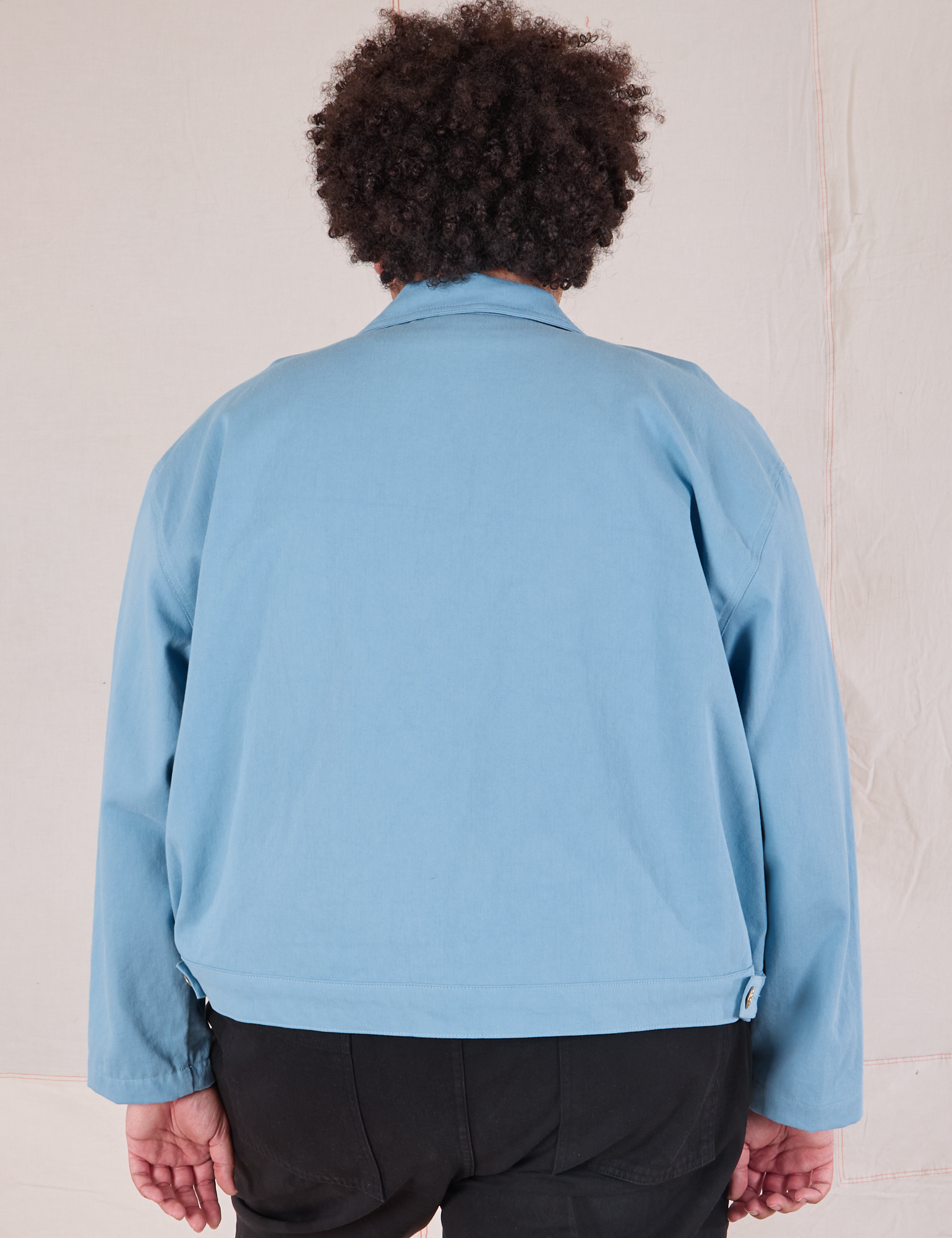Mechanic Jacket in Baby Blue back view on Miguel