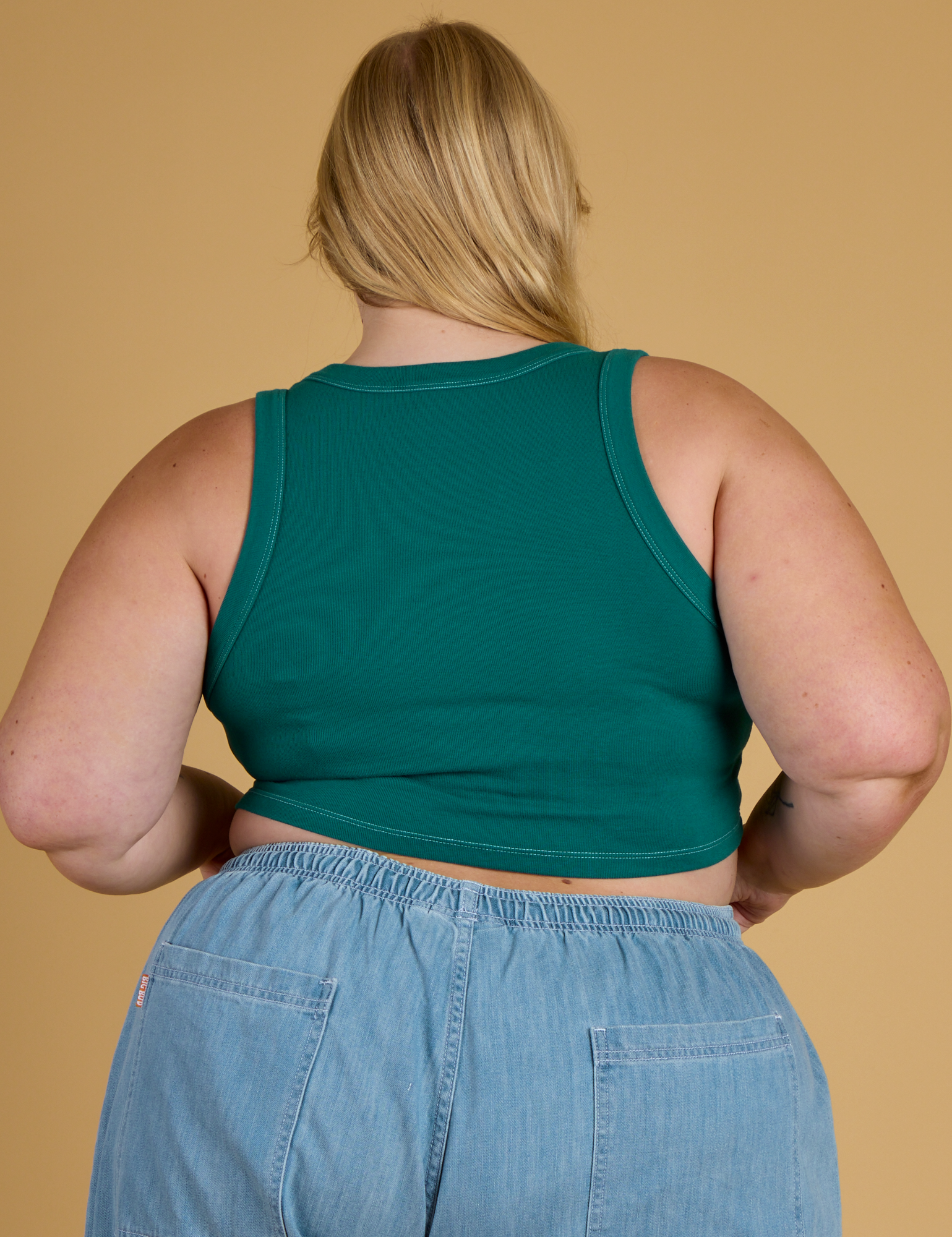 Contrast Stitch Mini Tank in Hunter Green back view on Juliet