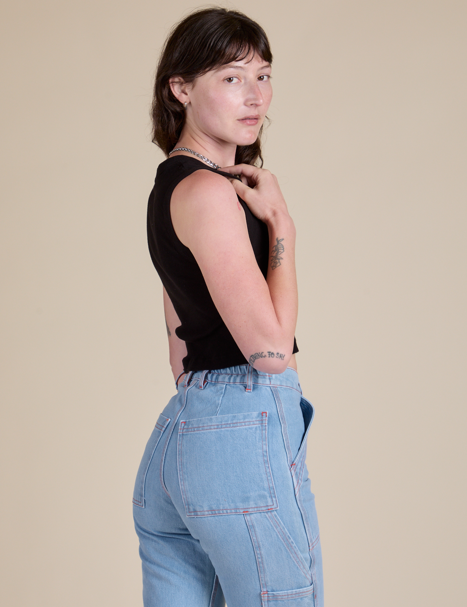 Muscle Tee in Basic Black side view on Alex