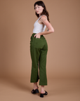 Angled back view of Organic Action Pants in Evergreen on Alex