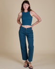 Alex is wearing Racerback Tank in Lagoon and matching Work Pants