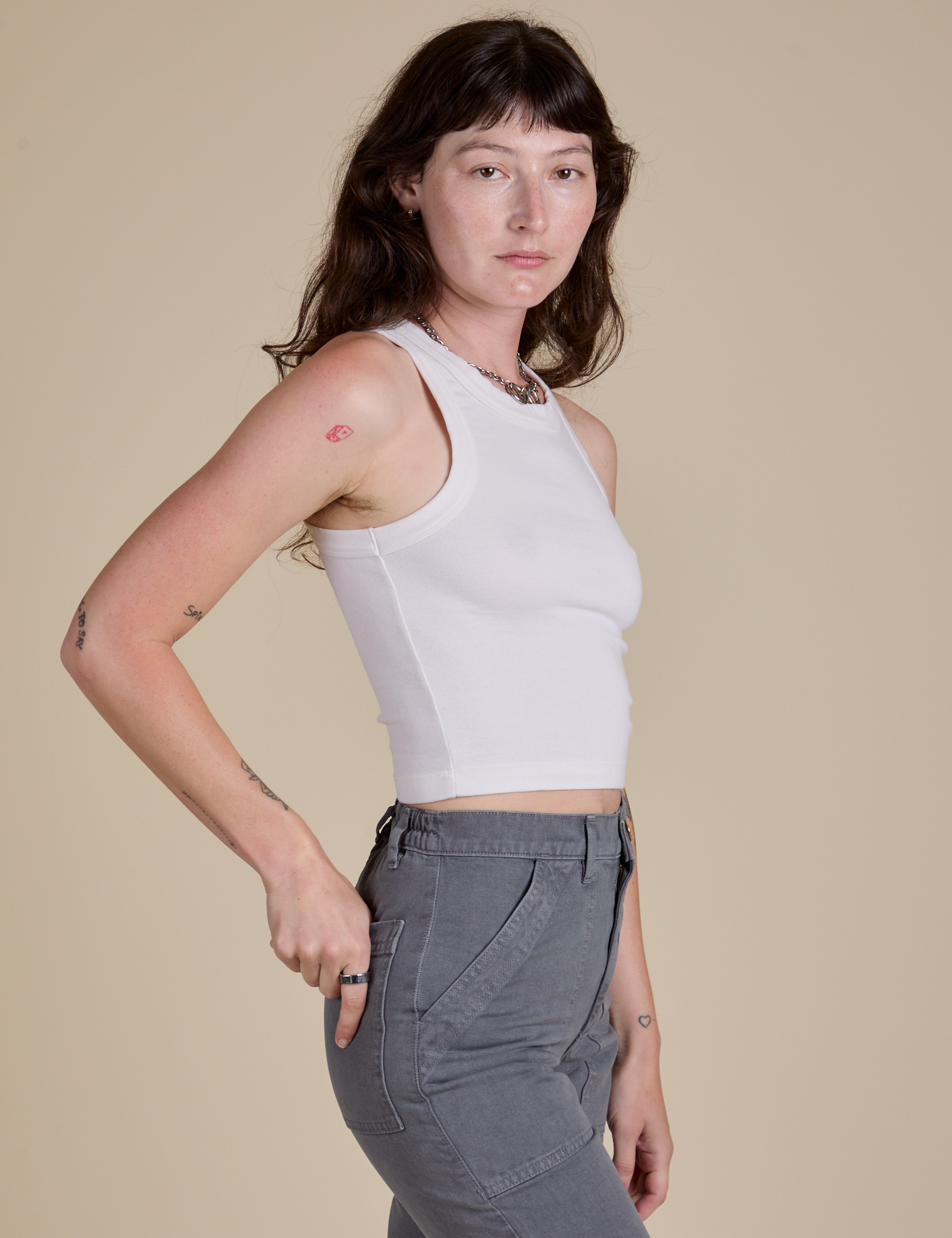 Racerback Tank in Vintage Tee White side view on Alex