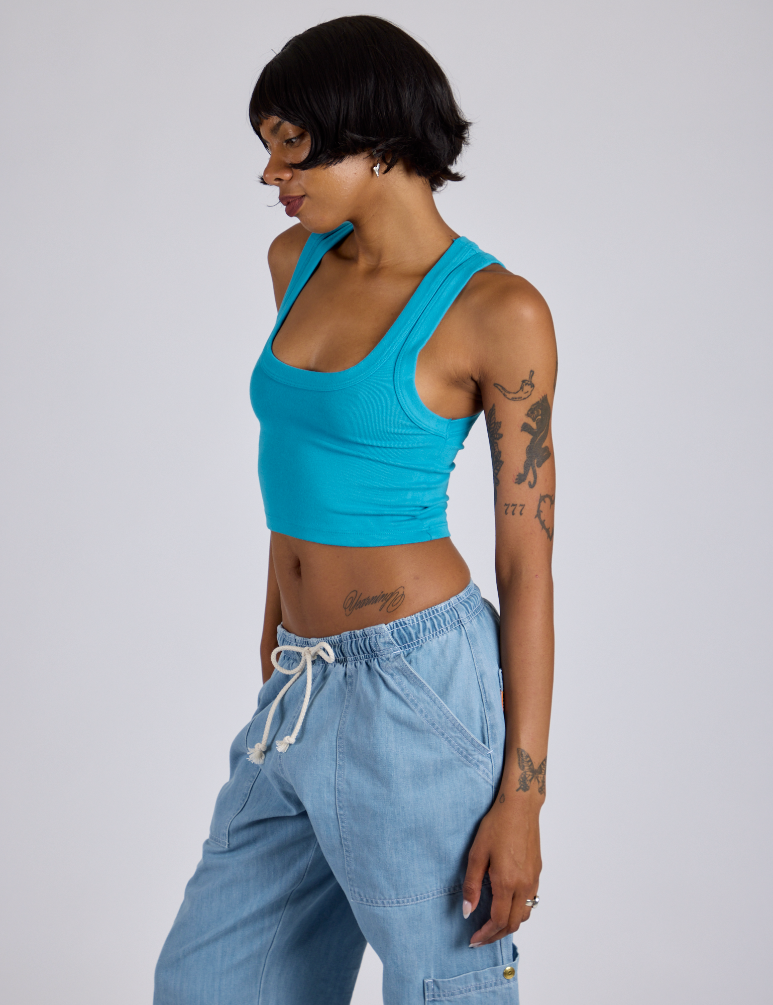 Angled front view of Cropped Tank Top in Hawaiian Blue on Kira