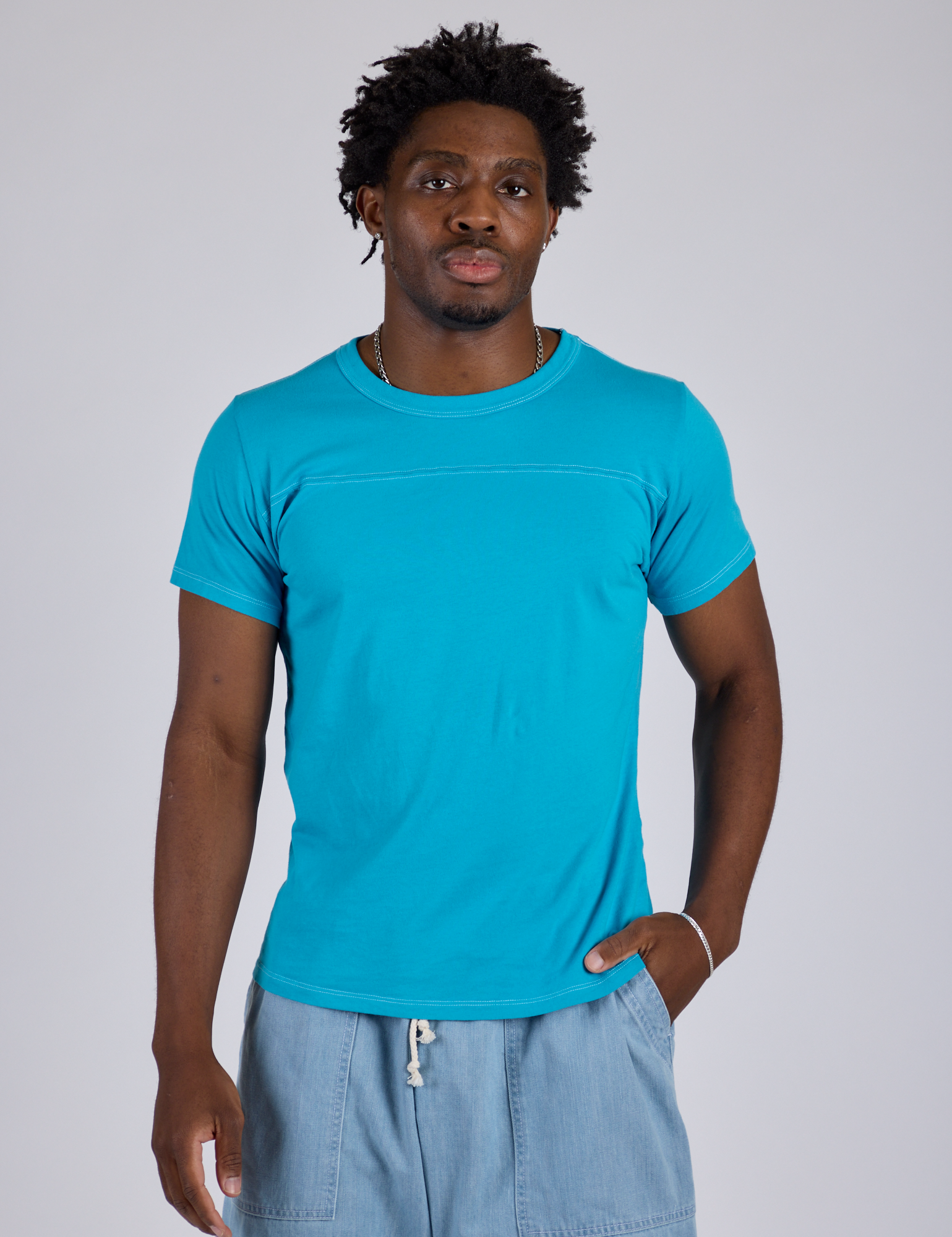 Isaac is 5’10” and wearing M Jr. Varsity Tee in Hawaiian Blue 