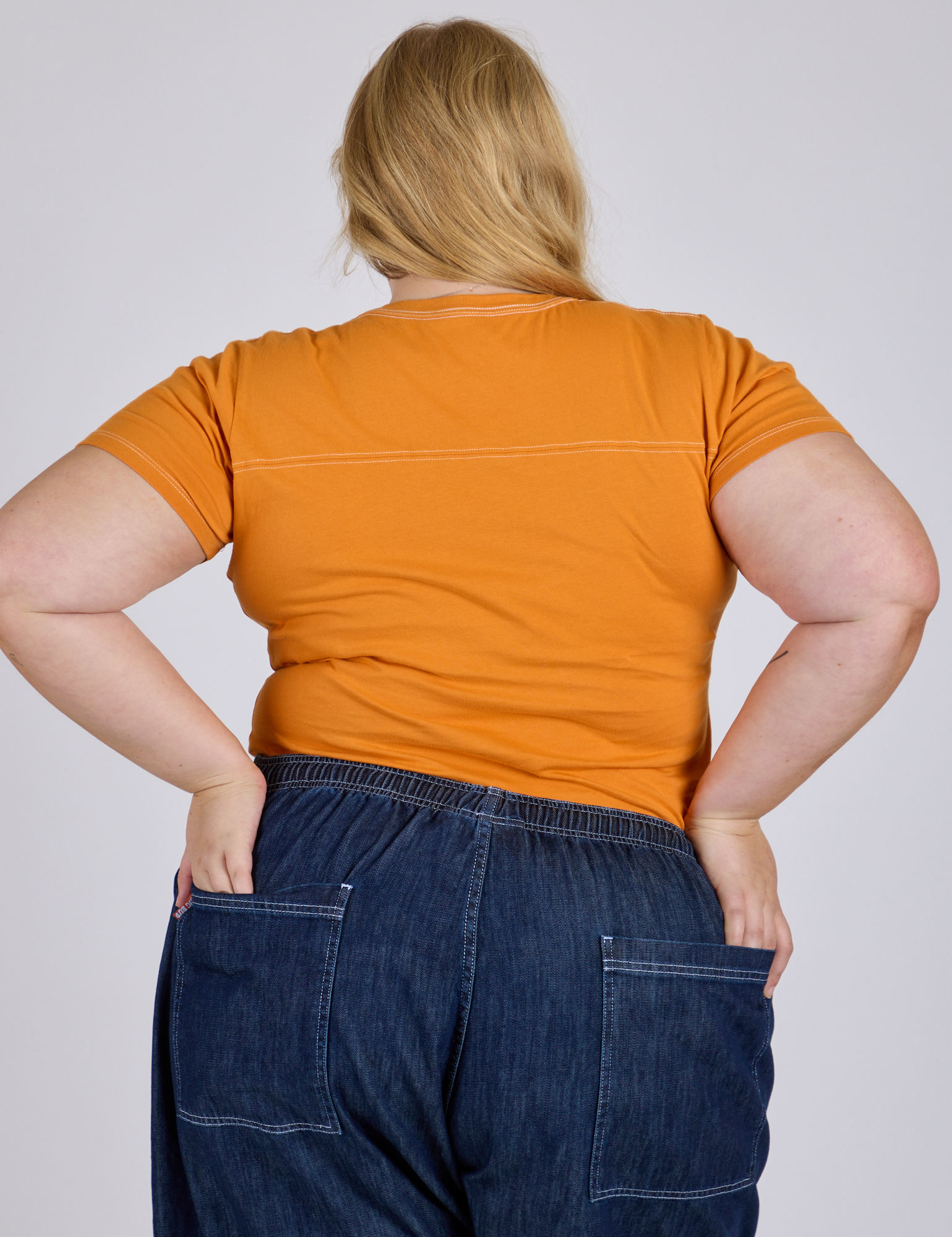 Jr. Varsity Tee in Creamsicle Orange back view on Juliet
