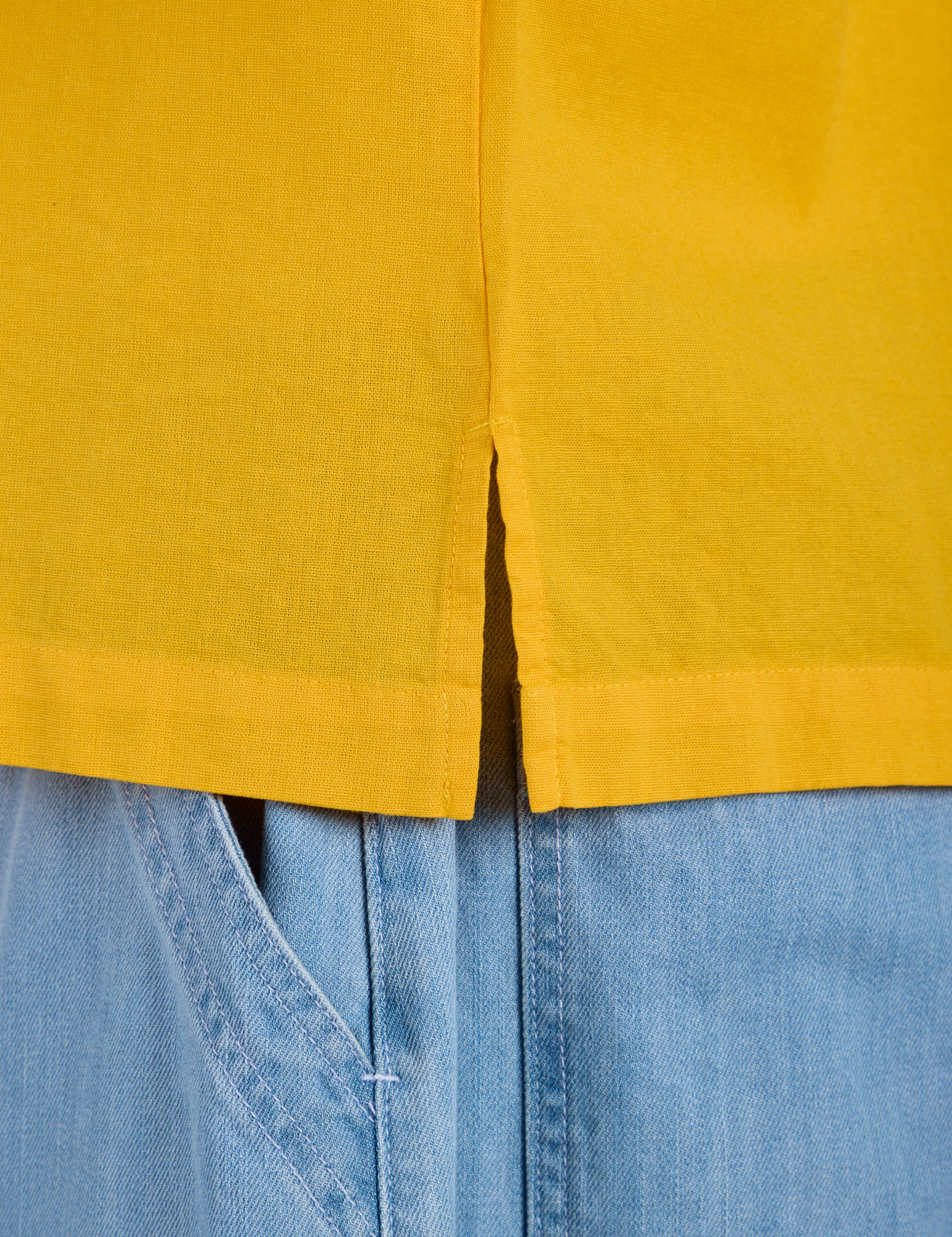 Close up of Pantry Button-Up in Sunshine Yellow side vent
