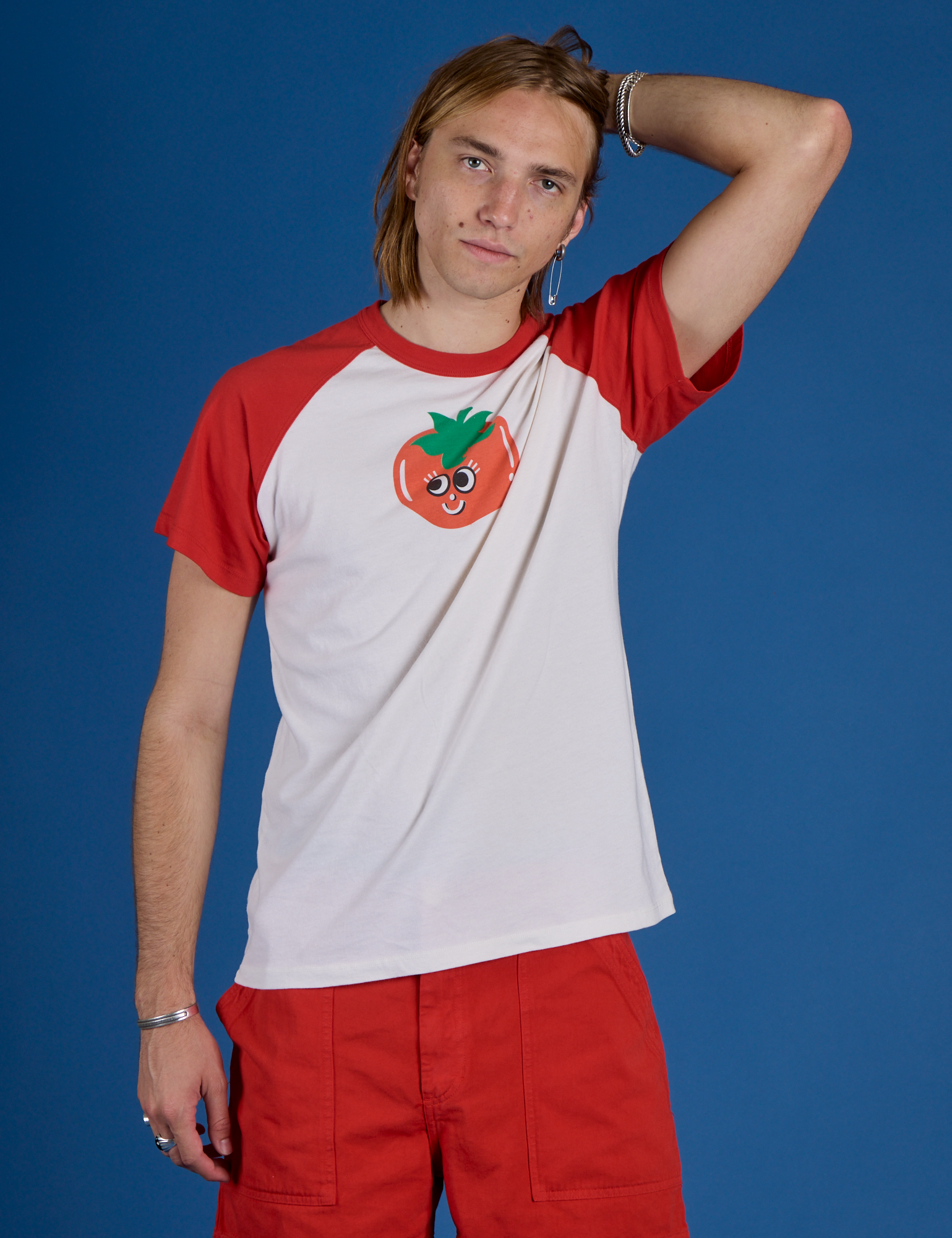 Grant is 6’5” and wearing L Produce Raglan Tee in Tomato