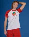 Grant is 6’5” and wearing L Produce Raglan Tee in Tomato