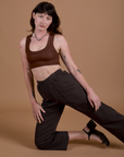 Alex is wearing Work Pants in Espresso Brown and Mini Tank in Fudgesicle Brown
