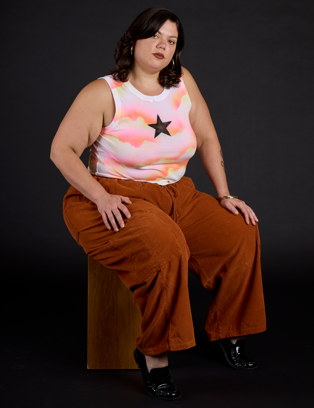 Kristen wearing the Black Star Airbrush Muscle Tee with Burnt Terracotta Corduroy Drop Pocket Cargo Pant