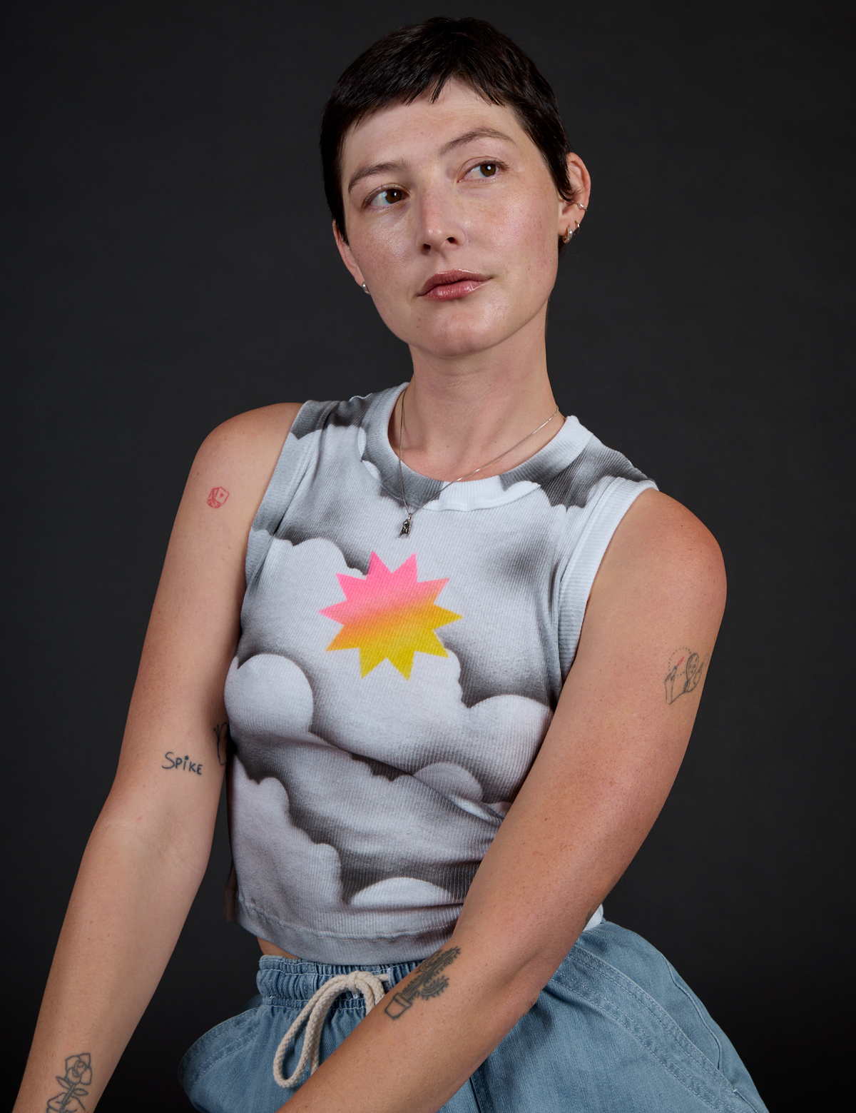 Close up of Alex in the Dark Cloud Airbrush Muscle Tee