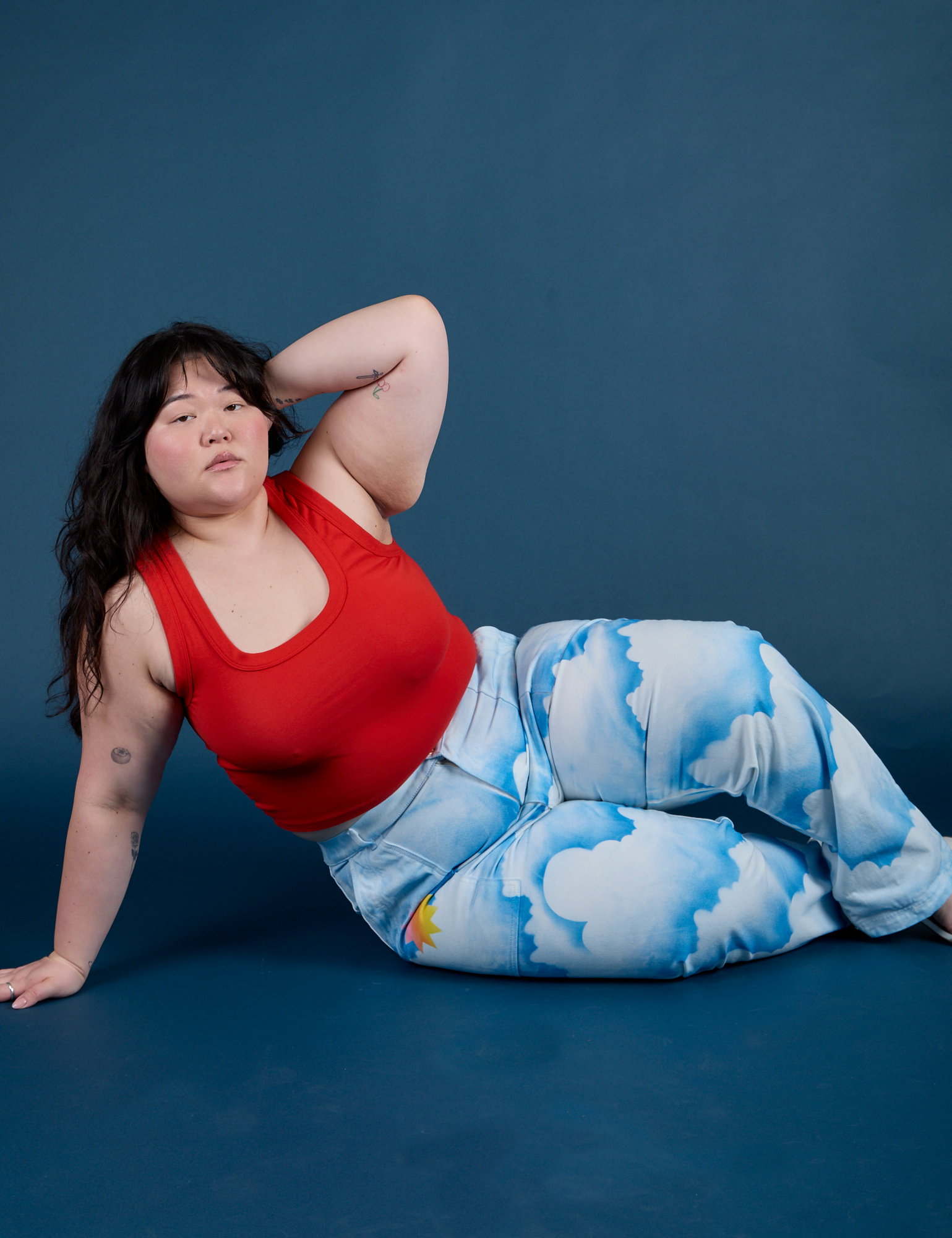 Work Pants in Sunny Cloud Airbrush and mustang red Tank Top worn by Ashley