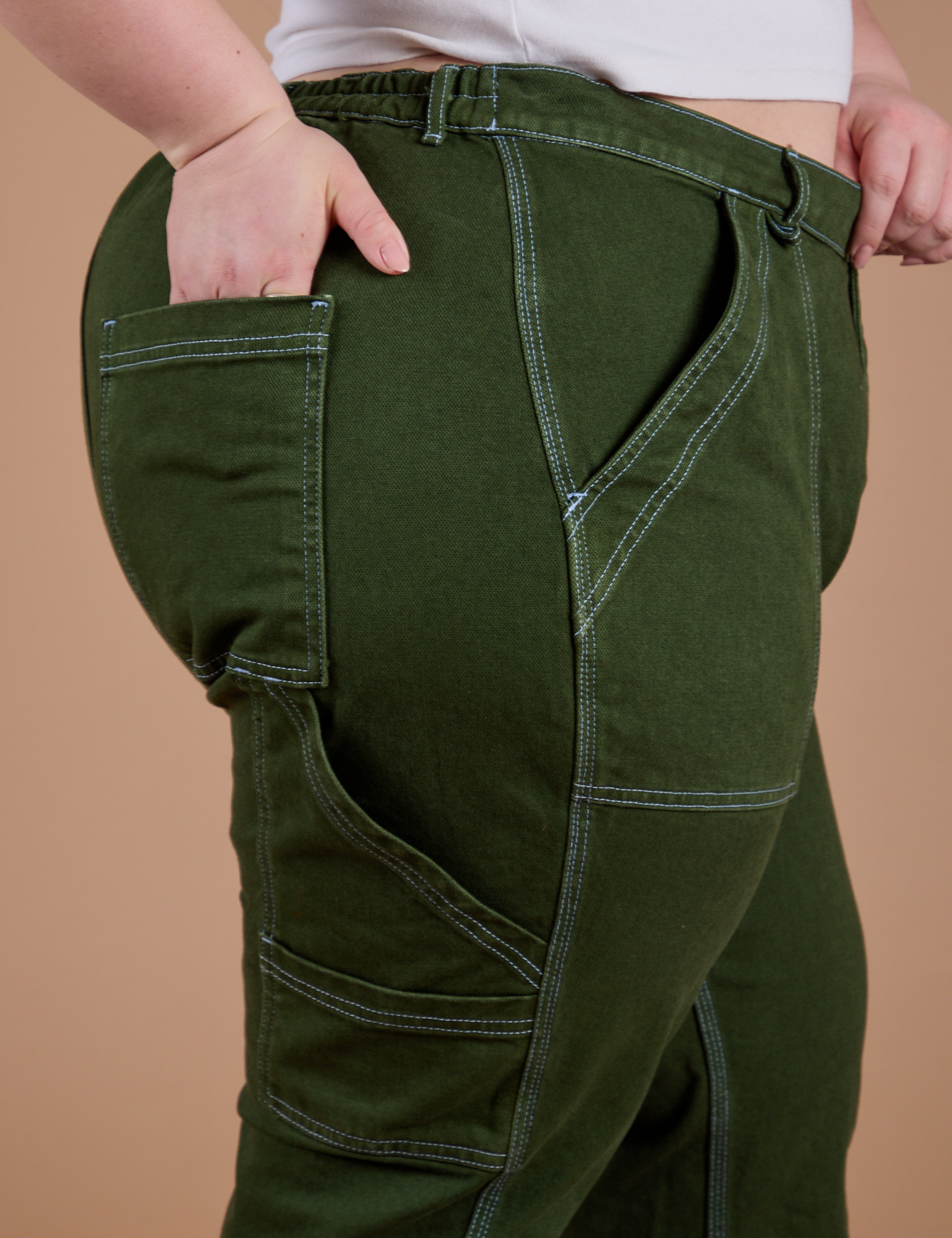 Carpenter Jeans in Evergreen side view close up on Ashley