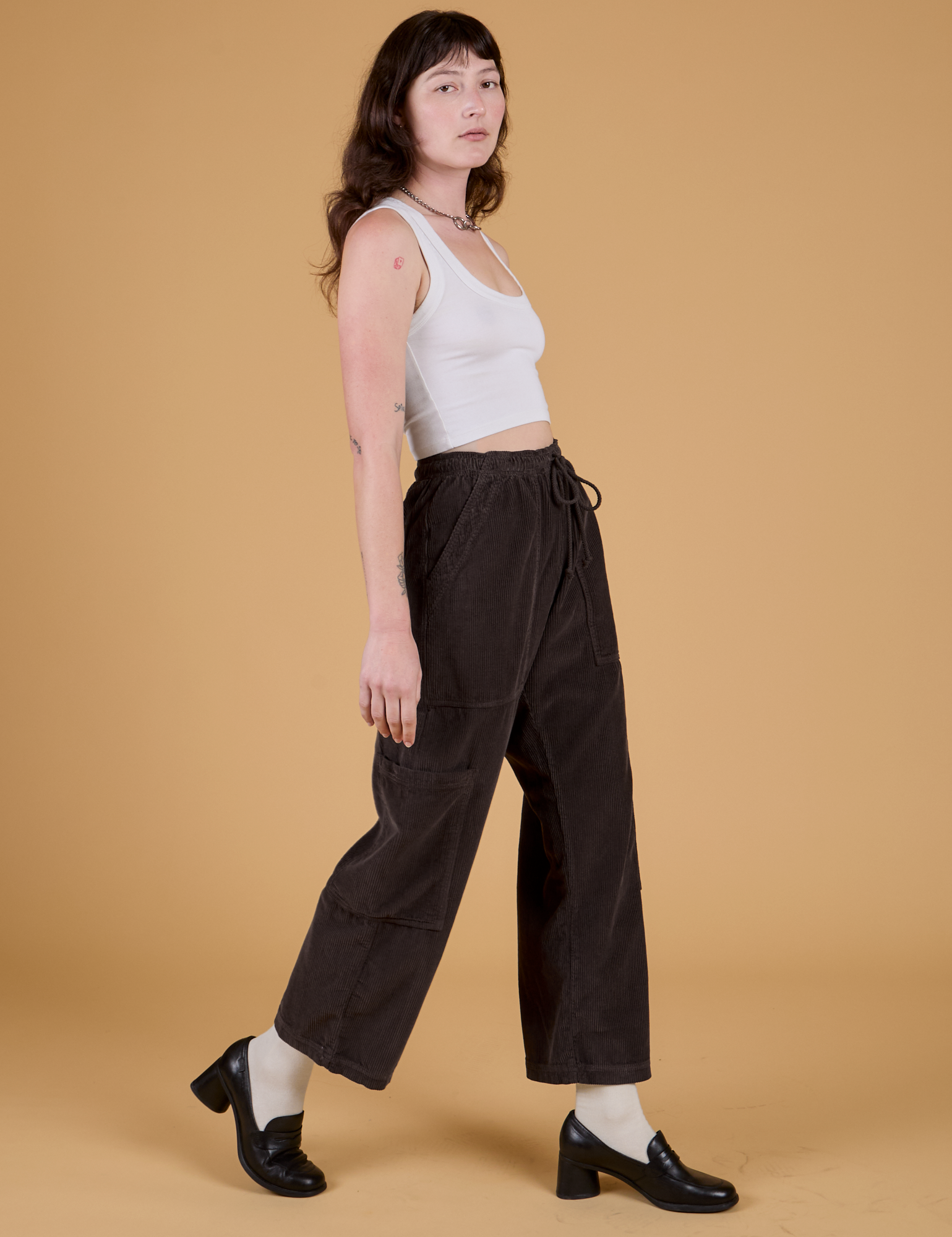 Corduroy Drop Pocket Cargo Pants in Espresso Brown and Cropped Tank in Vintage Tee White side view on Alex