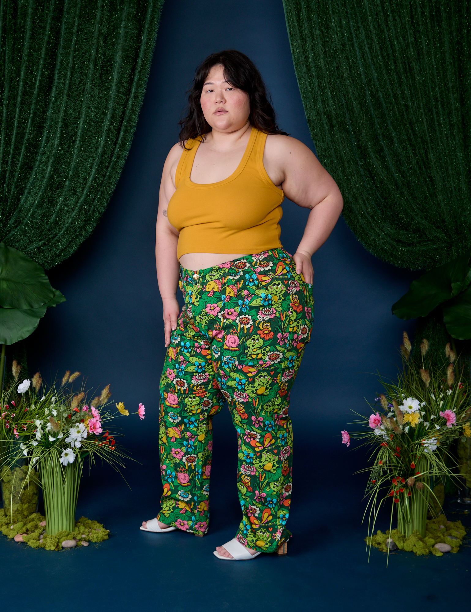 Side view of Work Pants in Pond Party and mustard yellow Cropped Tank on Ashley