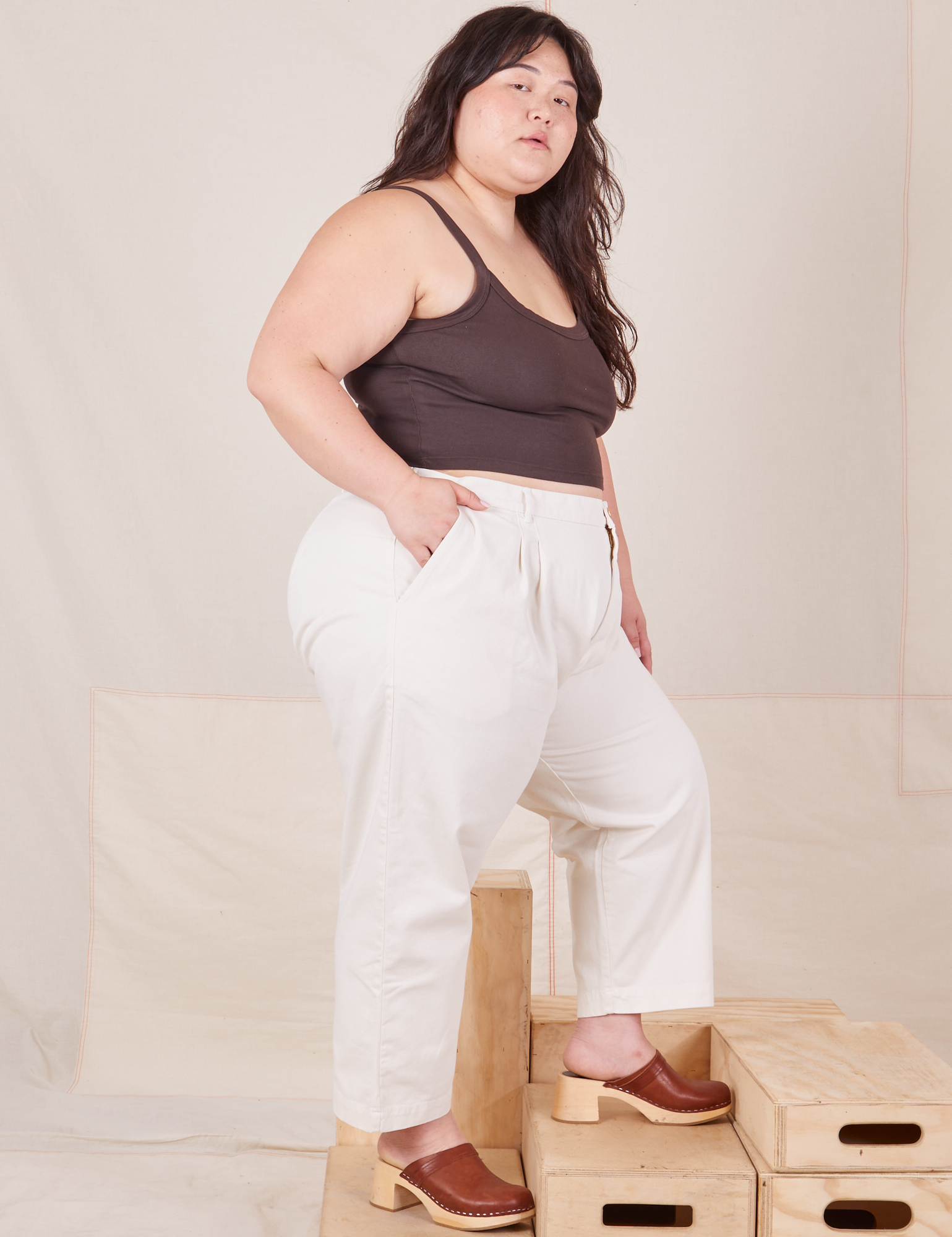 Side view of Heavyweight Trousers in Vintage Tee Off-White and espresso brown Cropped Cami worn by Ashley