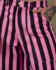 Close up of Jesse's hand in the front pocket of Longline Work Shorts in Bubblegum Pink