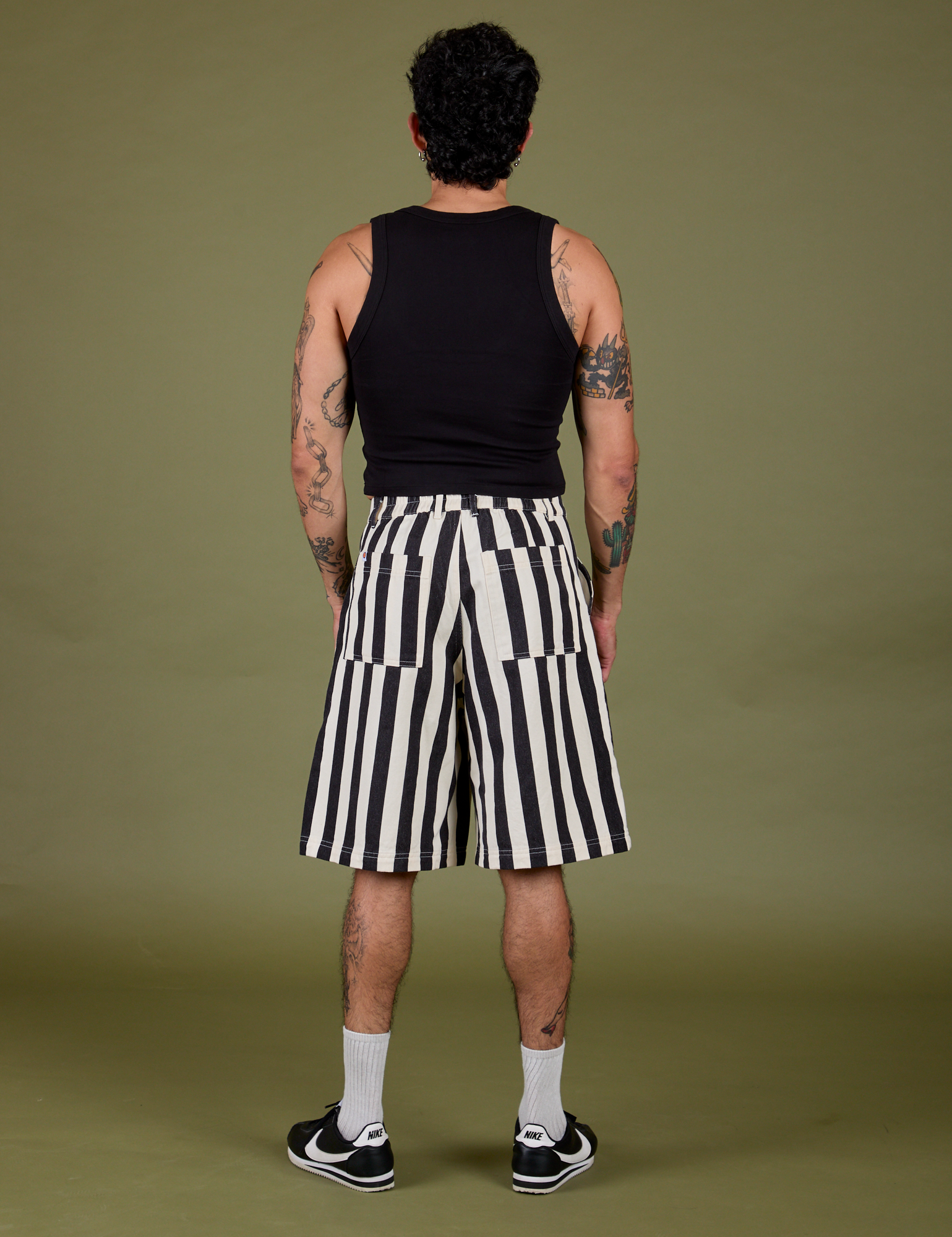 Back view of Longline Work Shorts in Natural and black Cropped Tank on Jesse