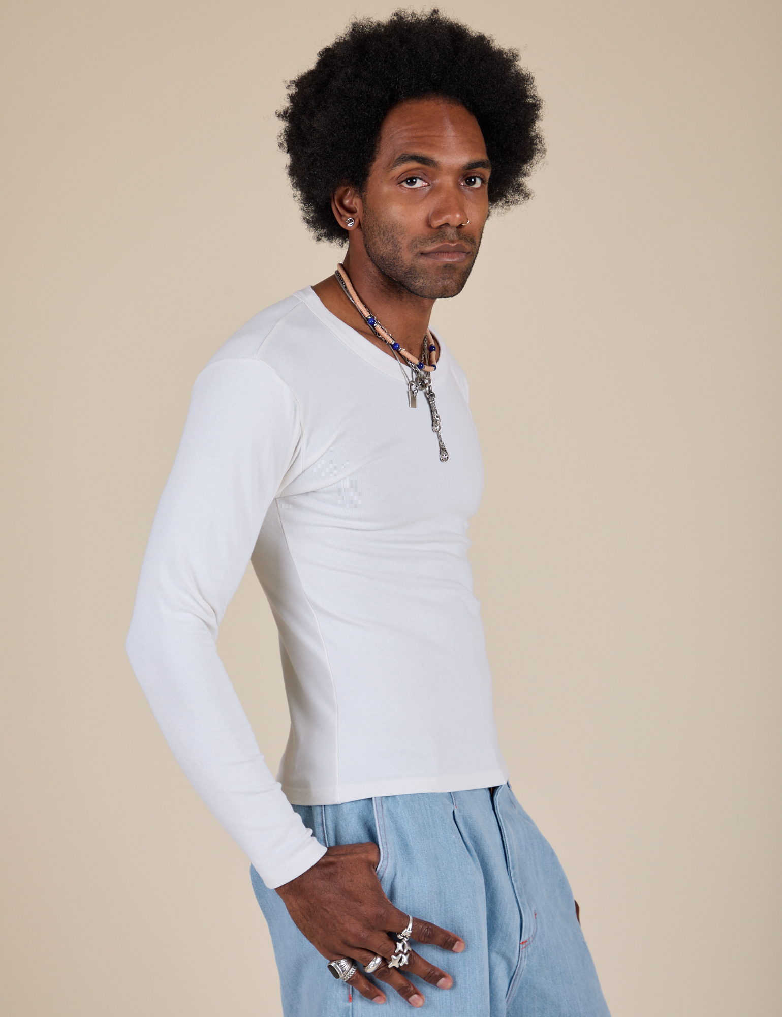 Long Sleeve Baby Tee in Vintage Tee Off-White side view on Jerrod