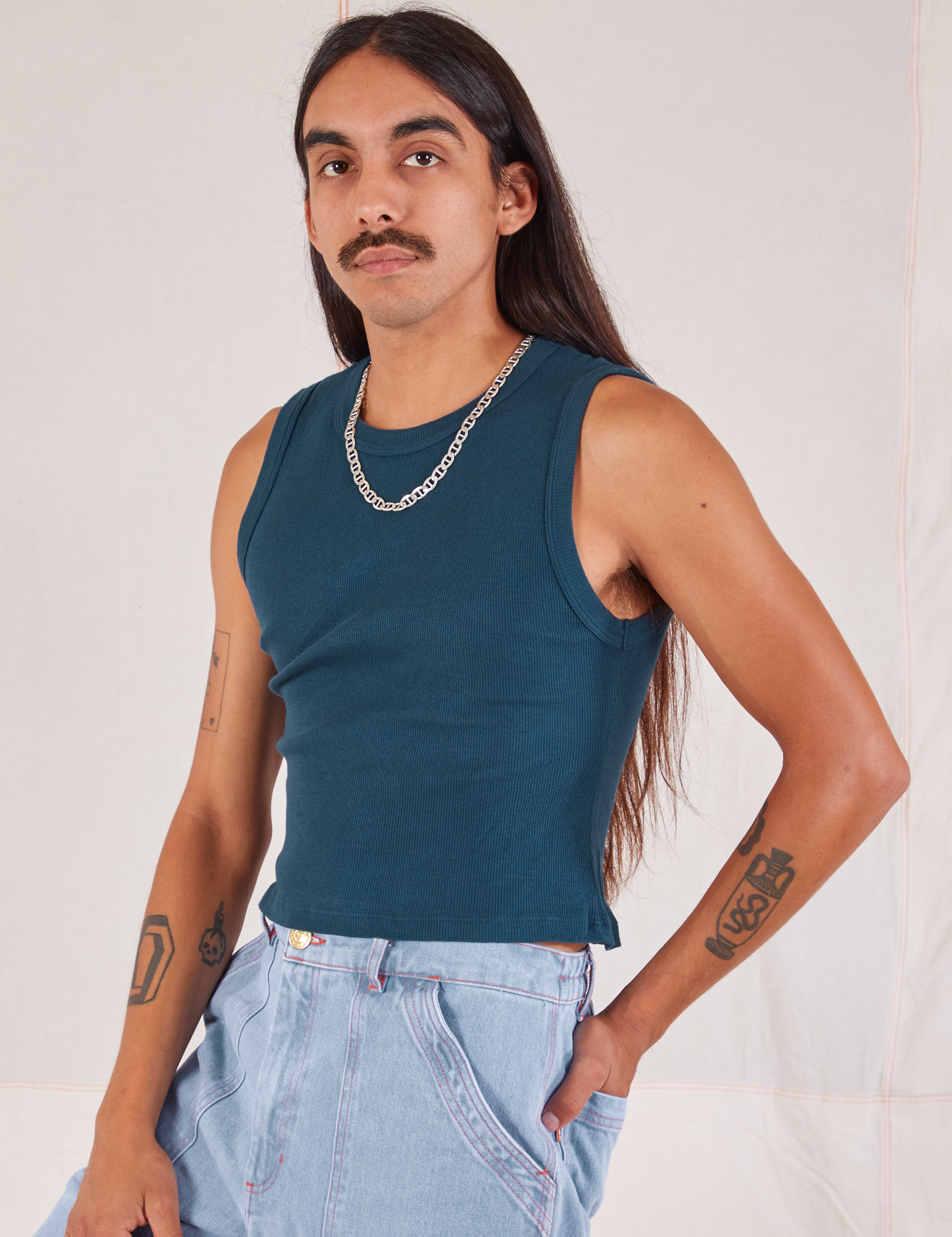 Muscle Tee in Lagoon angled front view on Anthony