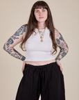 Sydney is 5'9" and wearing XXS Muscle Tee in Vintage Tee White