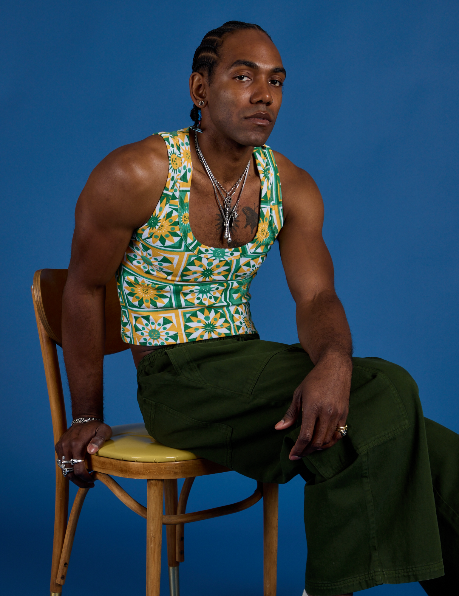 Jerrod is wearing Cropped Tank Top in Spring Quilt Print and evergreen Drop Pocket Cargo Pants