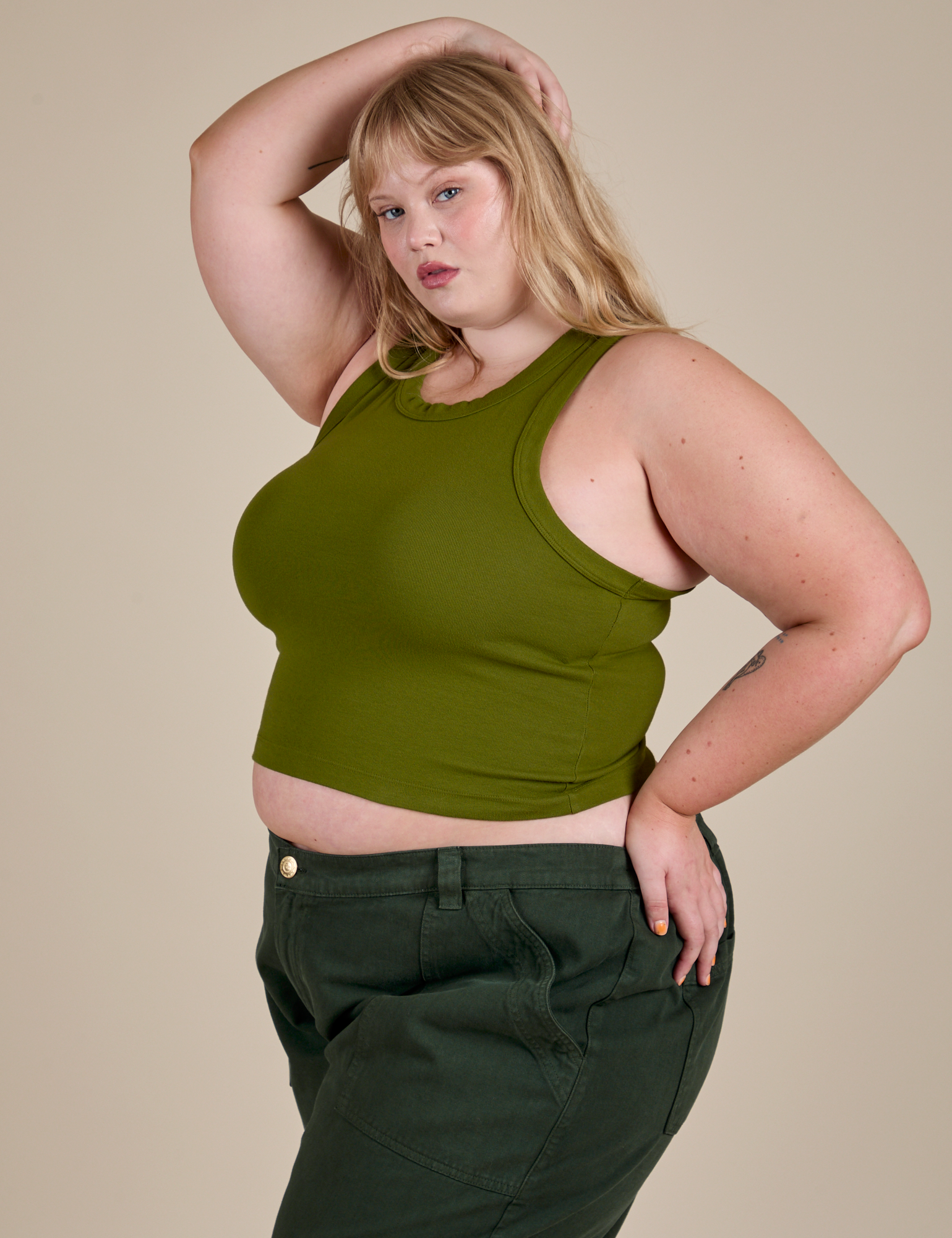 Racerback Tank in Summer Olive angled front view on Juliet