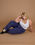 Juliet is wearing Railroad Denim Work Pants in Faded Grape Overdye and vintage tee white Cropped Tank