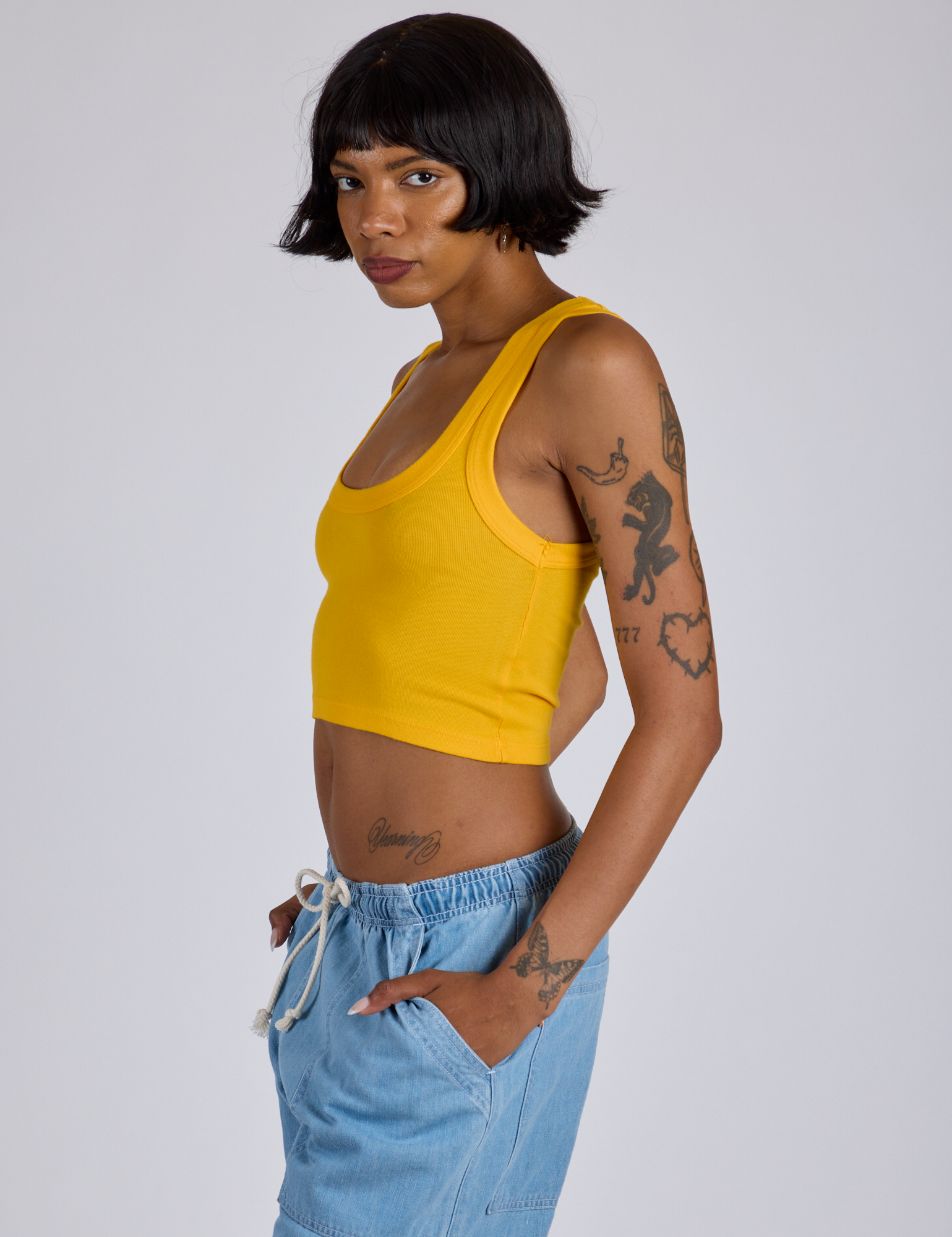 Cropped Tank Top in Sunshine Yellow side view on Kira