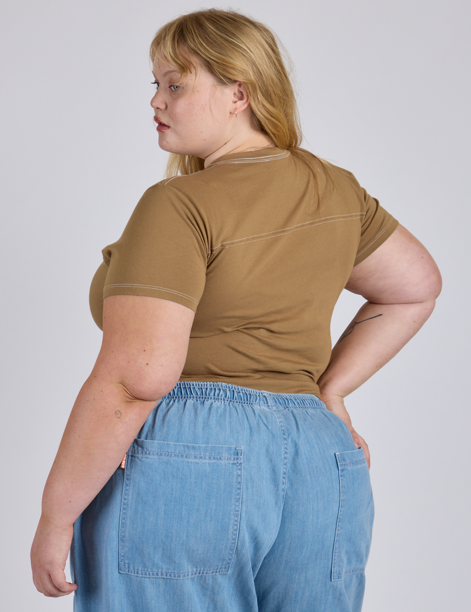 Angled back view of Jr. Varsity Tee in Desert Brown on Juliet