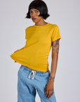 Kira is 5’10” and wearing P  Jr. Varsity Tee in Sunshine Yellow