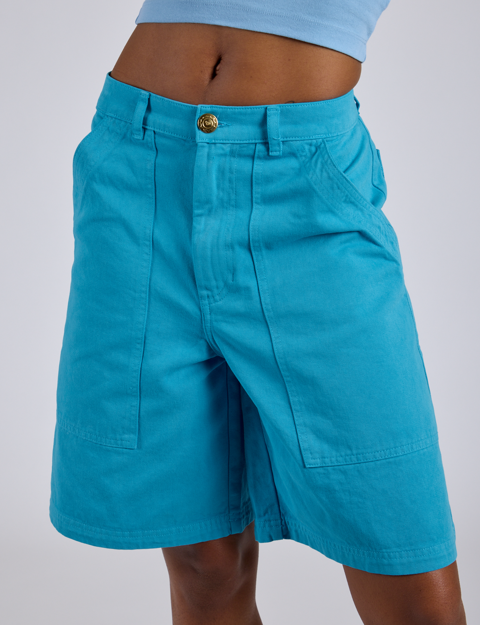 Longline Work Shorts in Hawaiian Blue front close up on Kira