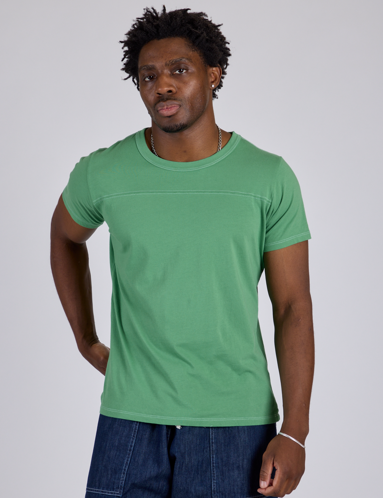 Isaac is 5’10” and wearing M Jr. Varsity Tee in Seafoam Green