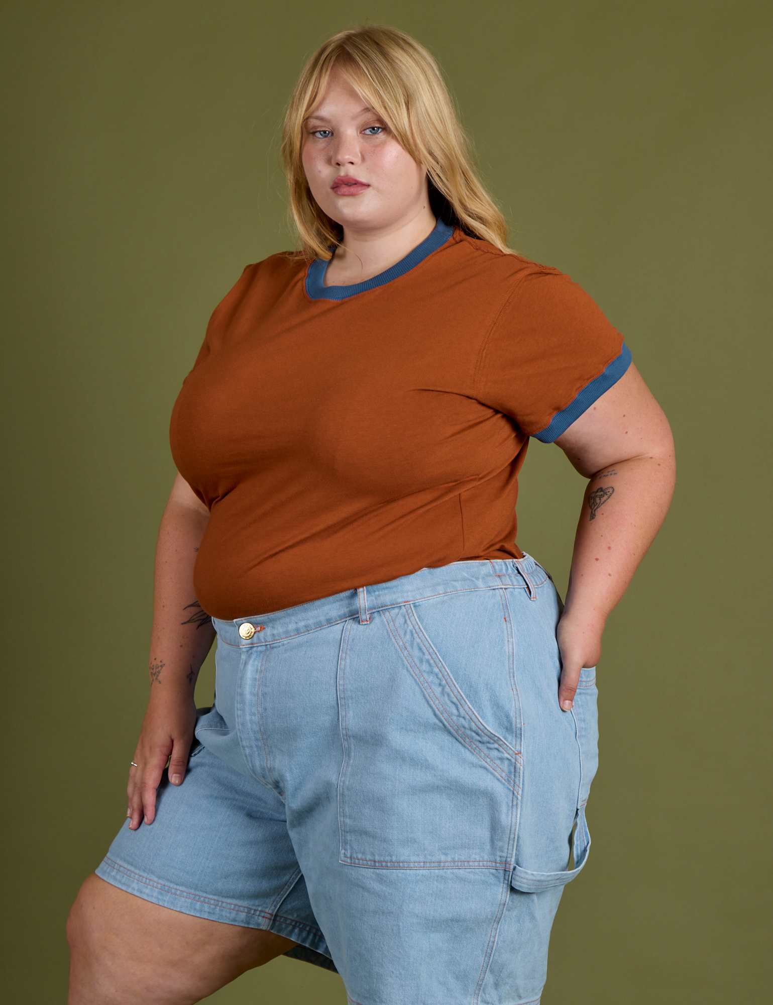 Angled front view of Vintage Ringer Tee in Burnt Terracotta and light wash Carpenter Shorts