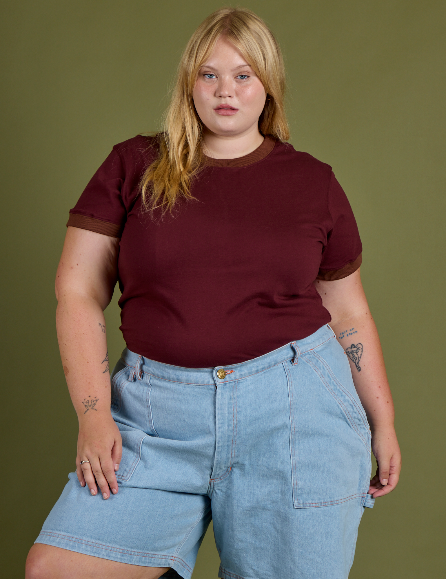 Juliet is wearing Vintage Ringer Tee in Red Wine tucked into light wash Carpenter Shorts