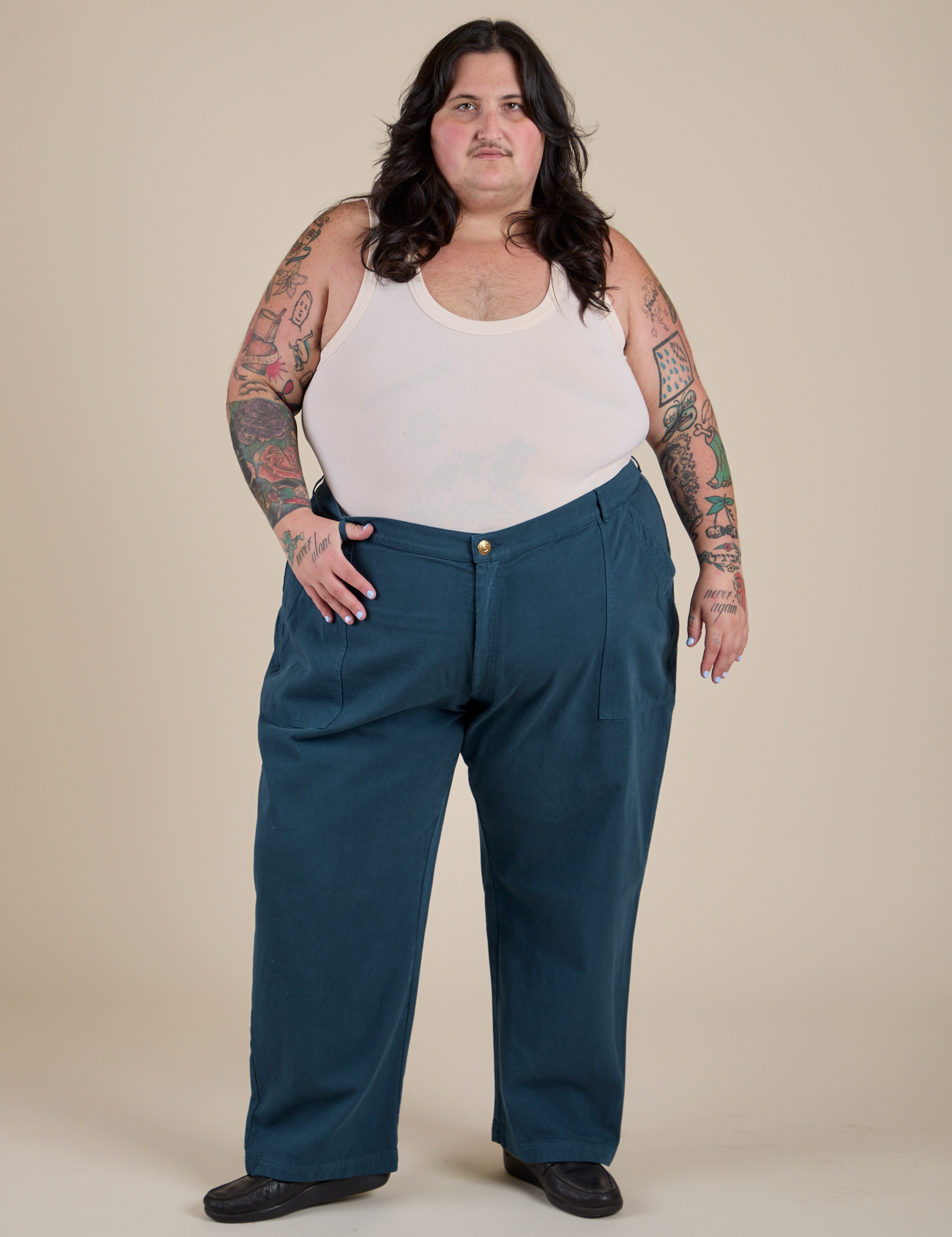 Sam is 5’10” and wearing 4XL Work Pants in Lagoon paired with vintage tee off-white Tank Top