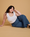 Ashley is wearing Heritage Wide Leg Trousers in French Blue and Cropped Tank in Vintage Tee White