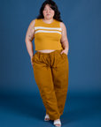 Ashley is wearing Painted Muscle Tee in Mustard Yellow and spicy mustard Drop Pocket Cargo Pants