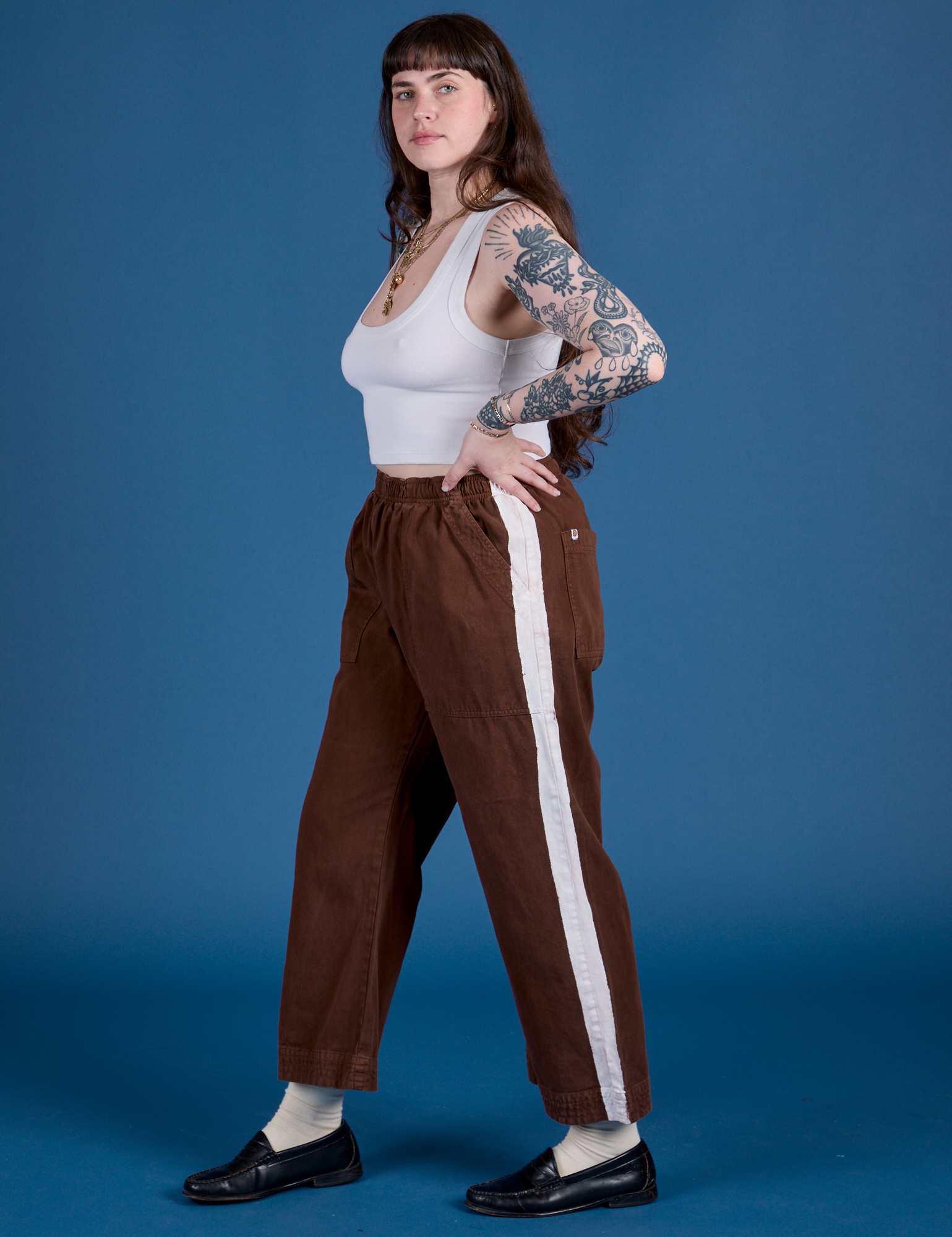 Side view of Painted Action Pants in Fudgesicle Brown and vintage tee white Cropped Tank on Sydney
