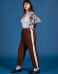 Side view of Painted Action Pants in Fudgesicle Brown and vintage tee white Cropped Tank on Sydney