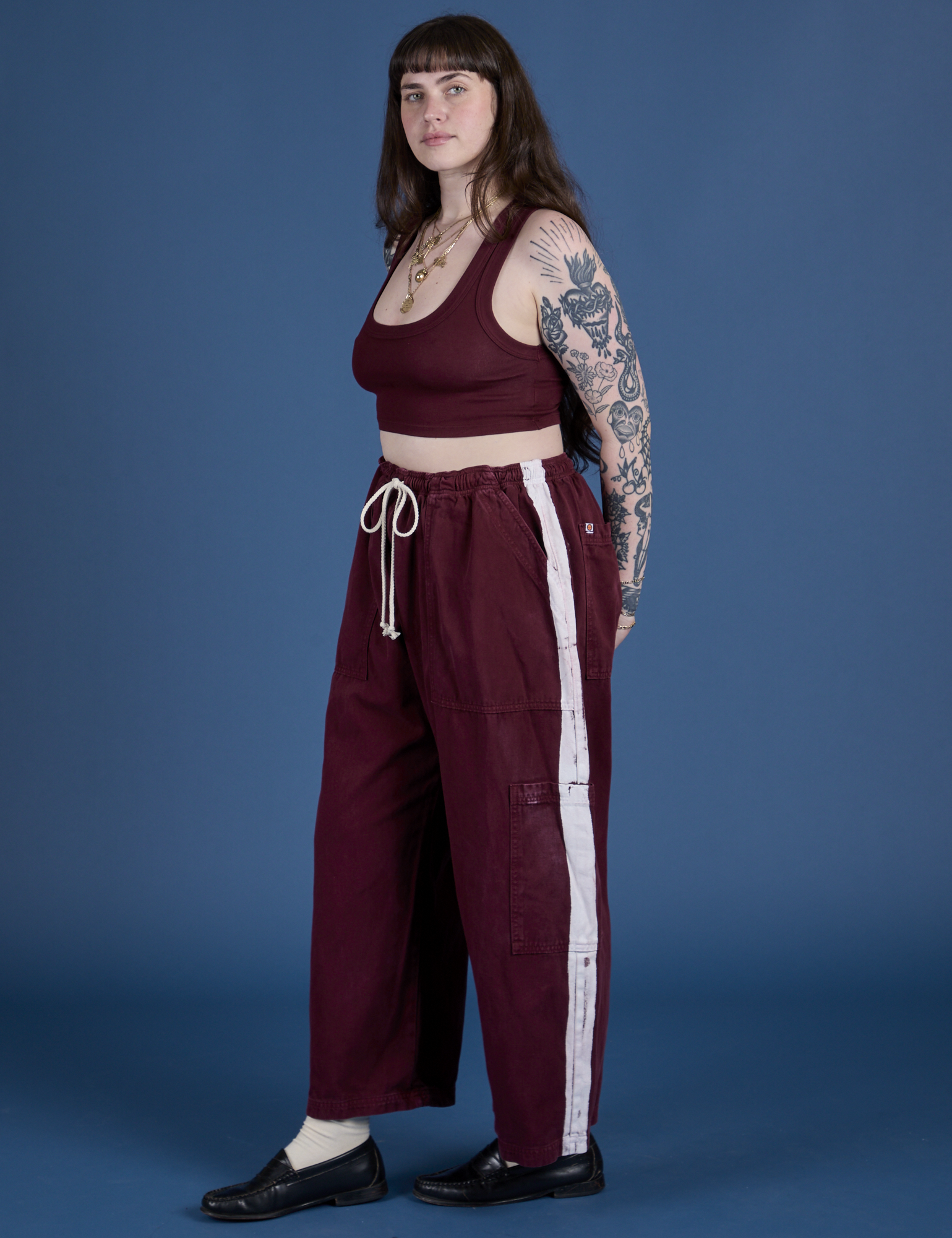 Side view of and Painted Drop Pocket Cargo Pants in Red Wine matching Mini Tank on Sydney
