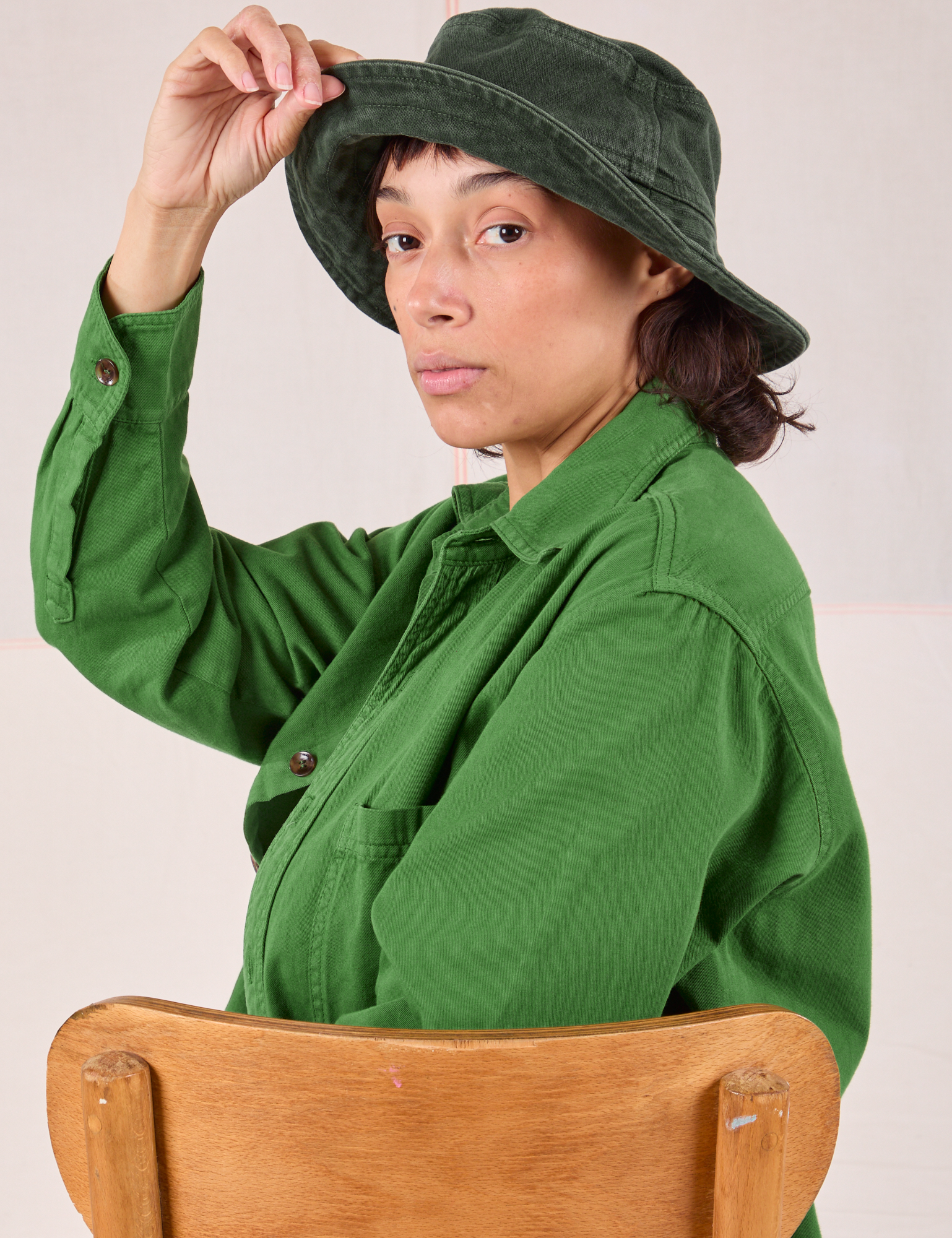 Tiara is wearing Wide Brim Denim Bucket Hats in Swamp Green