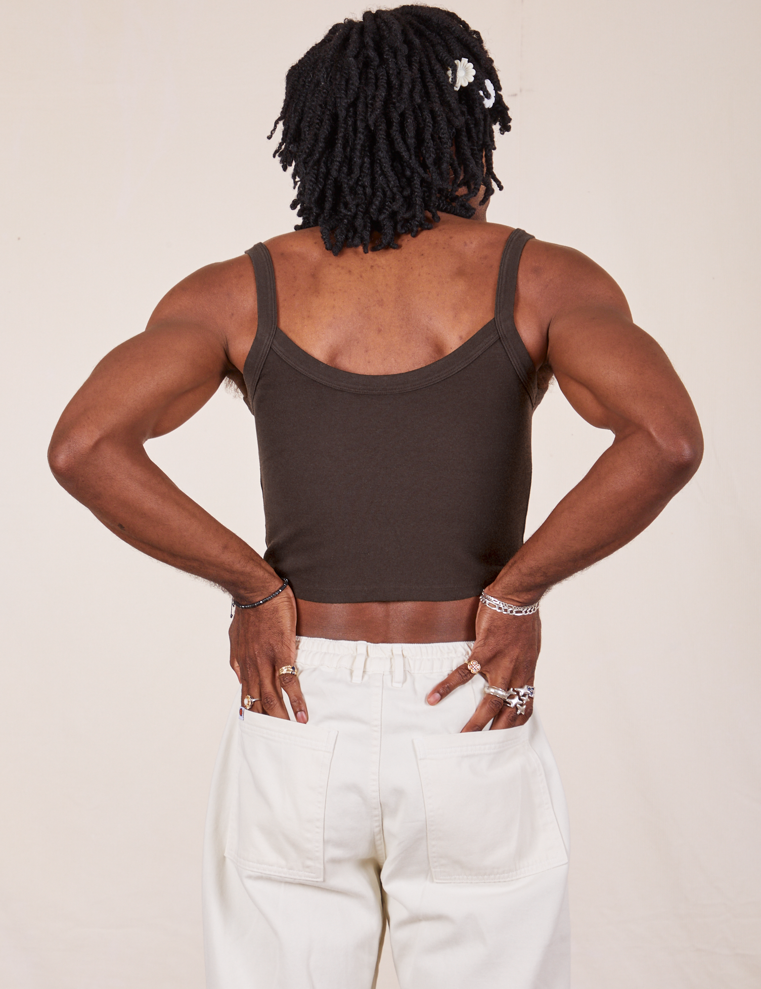 Back view of Cropped Cami in Espresso Brown and vintage tee off-white Western Pants worn by Jerrod